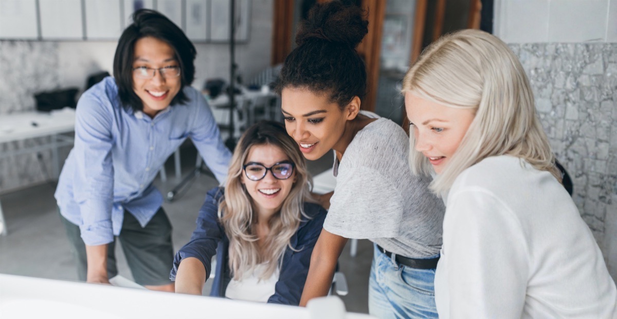 A team collaborating around a desk